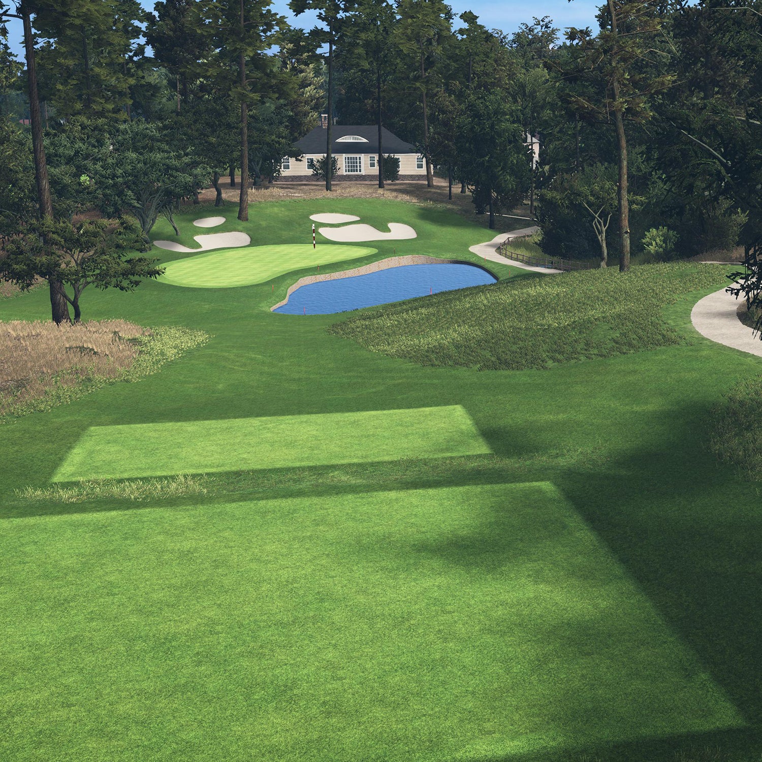 Golf course with green grass, trees, and a building in the background