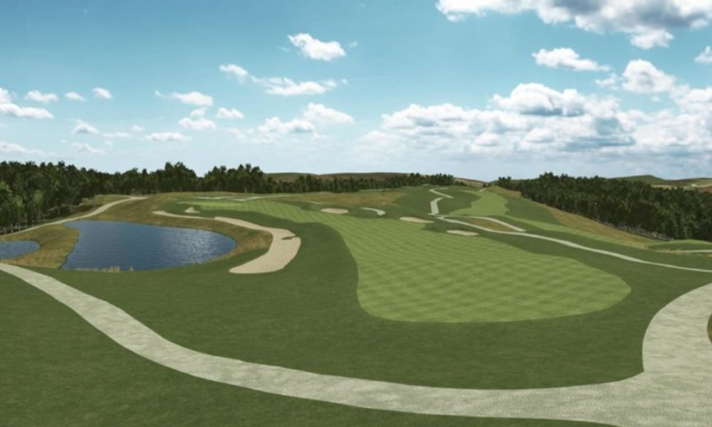 Golf course with green fairways and a blue sky