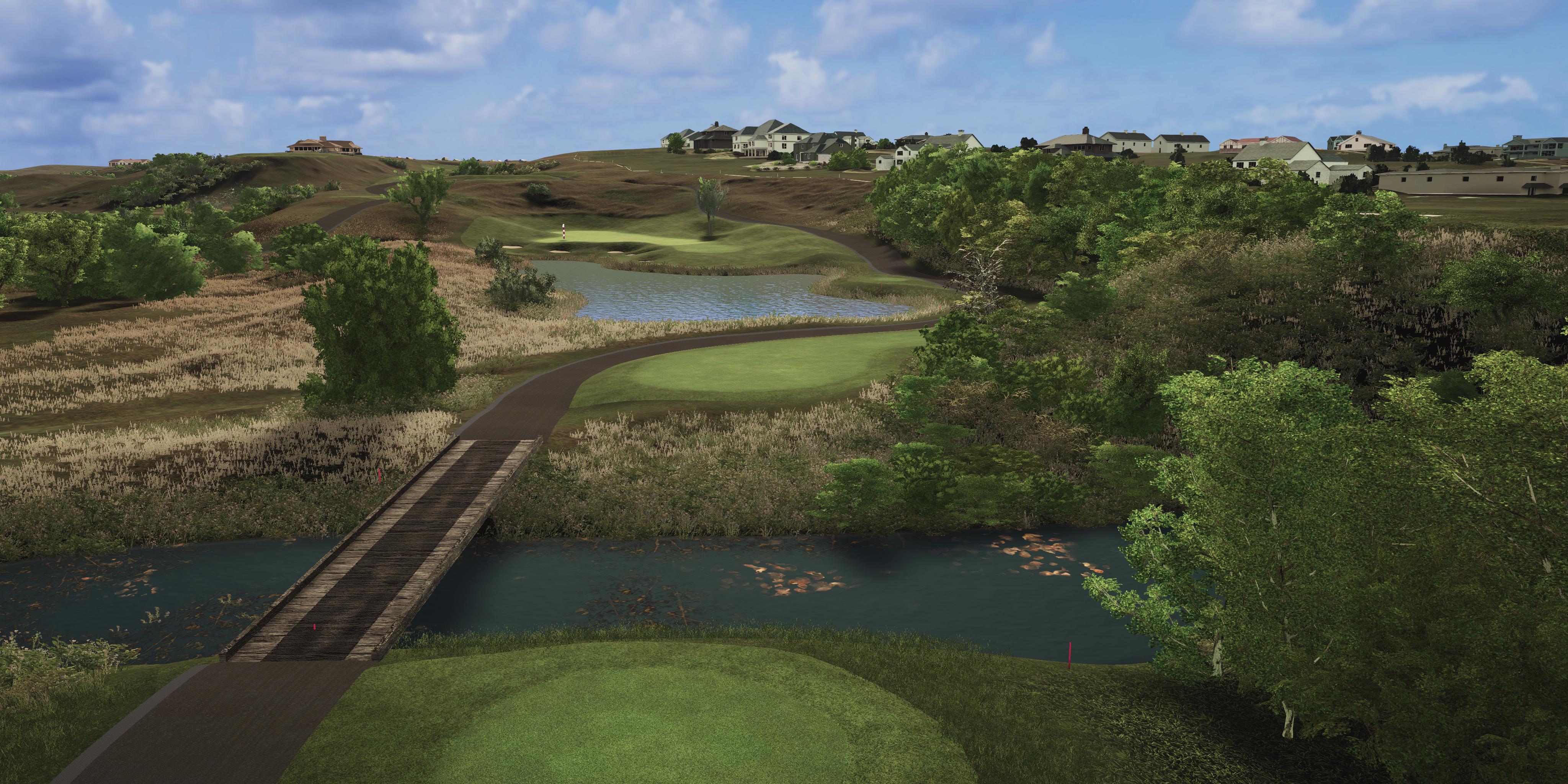 Golf course with green fairways, water hazards, and trees under a blue sky.