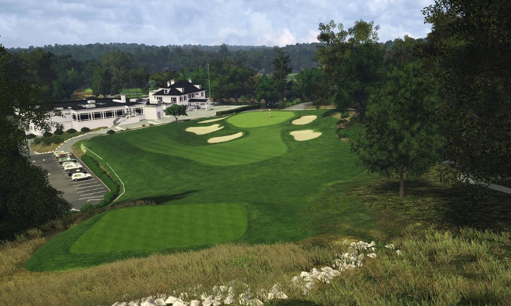 Golf course with a clubhouse and trees in the background