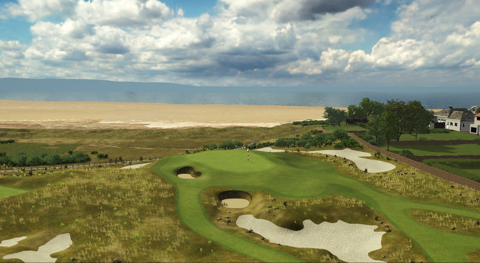 Golf course with a scenic view of a beach and sky.