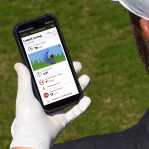 SKYTRAK mobile application display on a smartphone screen showing swing tempo, attack angle metrics, club speed, and peak hand speed data.