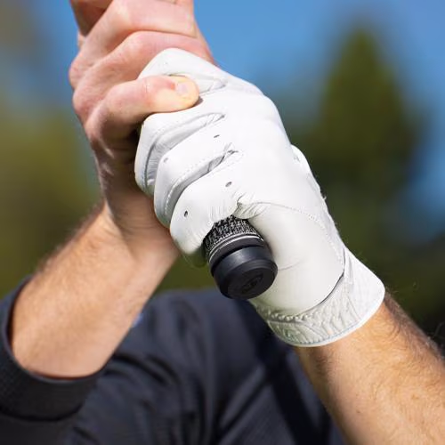 SKYTRAK compatible smart grip sensor cap attached flush to a golf club handle, tracking real-time swing analytics and grip data parameters.