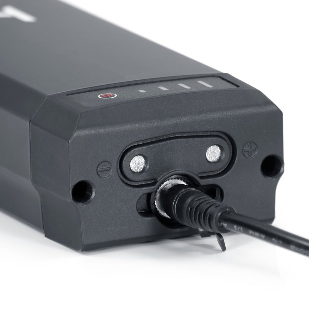 Bag Boy Volt golf cart battery, plugged in, close-up