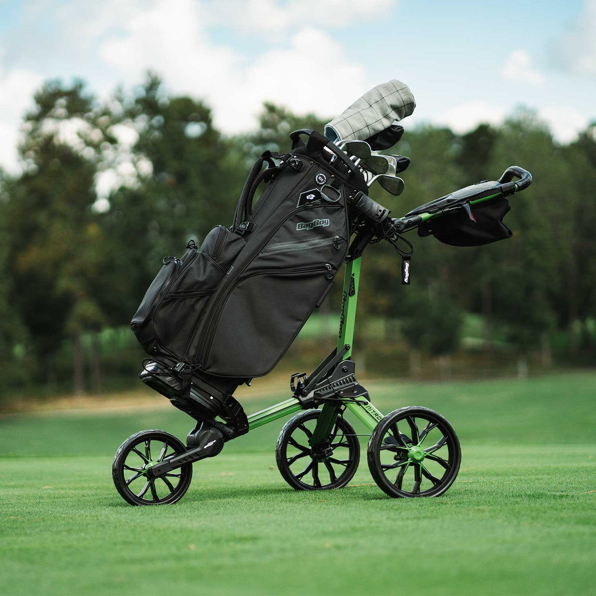 Bag Boy Chiller Pro Hybrid Stand Bag, black, on a green Nitron golf cart