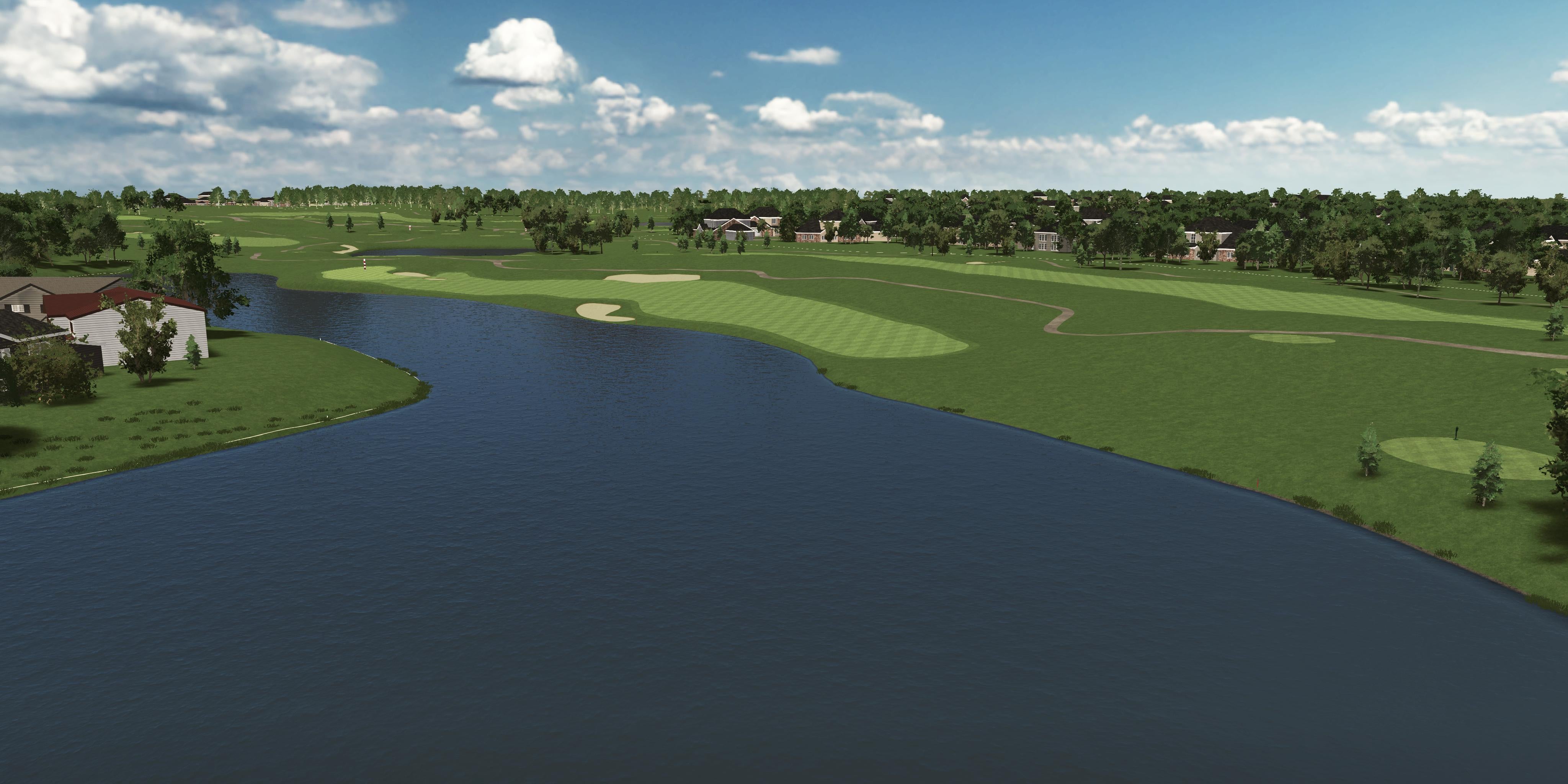 Golf course with a lake and greenery under a blue sky