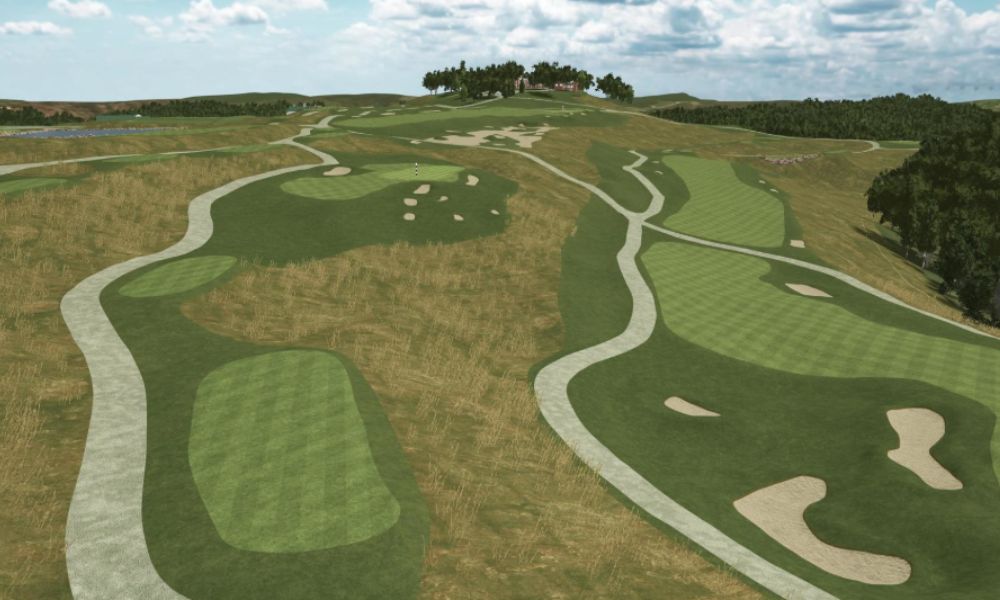 Golf course with green fairways and sand bunkers under a cloudy sky.