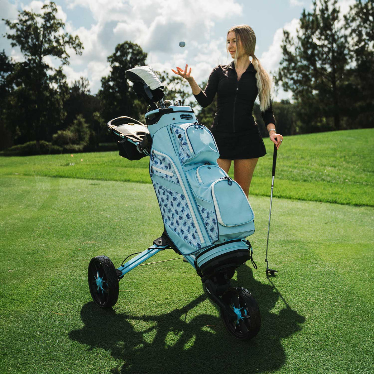 Bag Boy Nitron golf cart, ice blue, lifestyle photo, alternate version