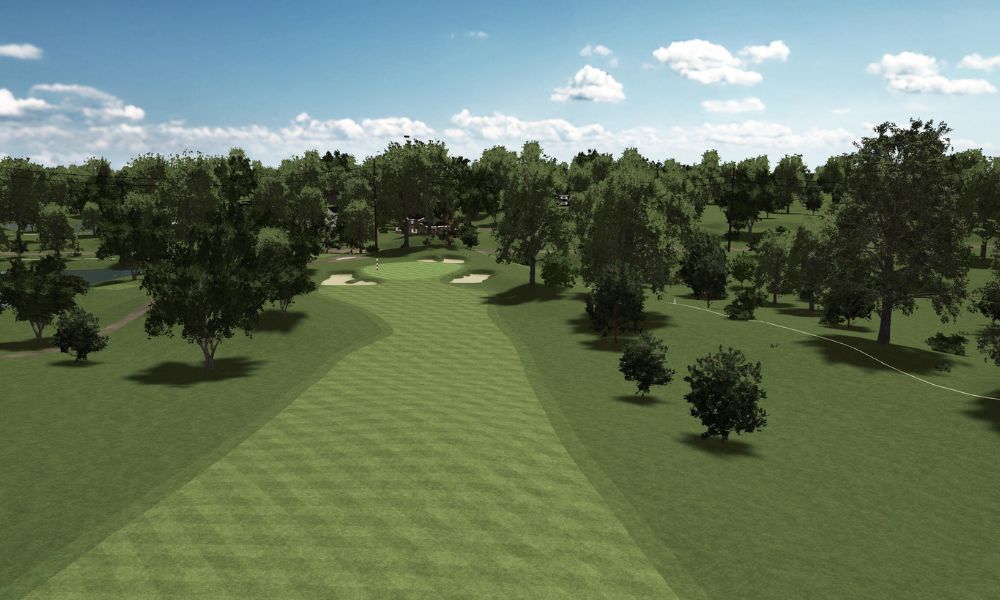 Golf course with green grass and trees under a blue sky