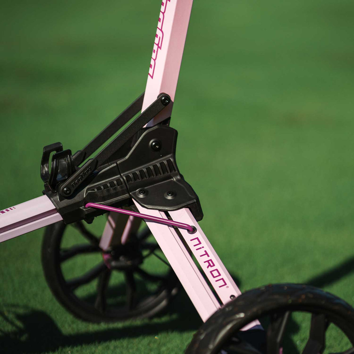 Bag Boy Nitron golf cart, pink and wine, close-up
