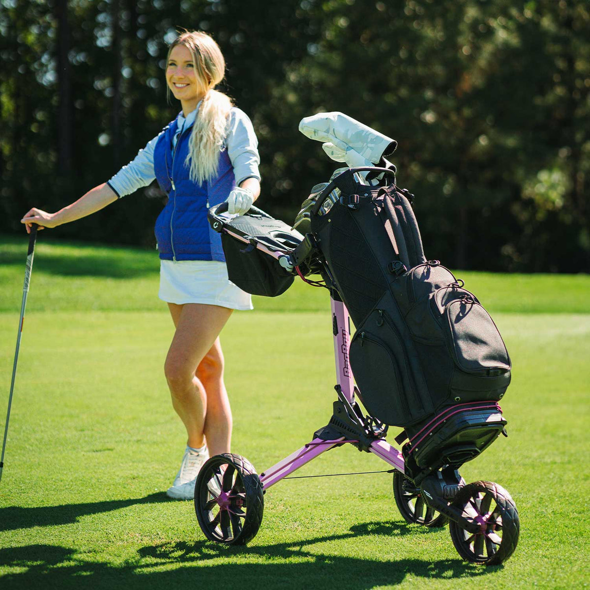 Bag Boy Nitron golf cart, pink and wine, lifestyle photo