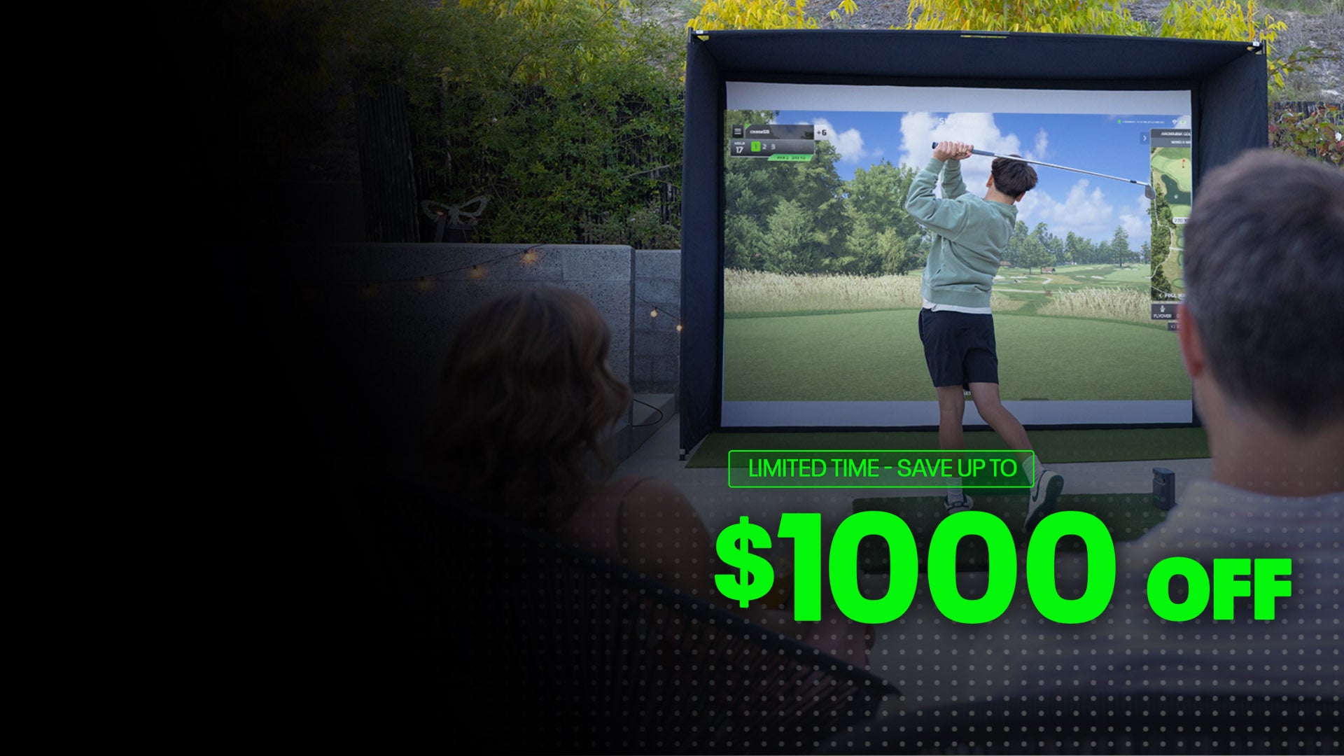 Family hitting a golf ball into a SkyTrak simulator screen during a Father's Day event, showcasing home golf practice and our new Pebble Beach course 