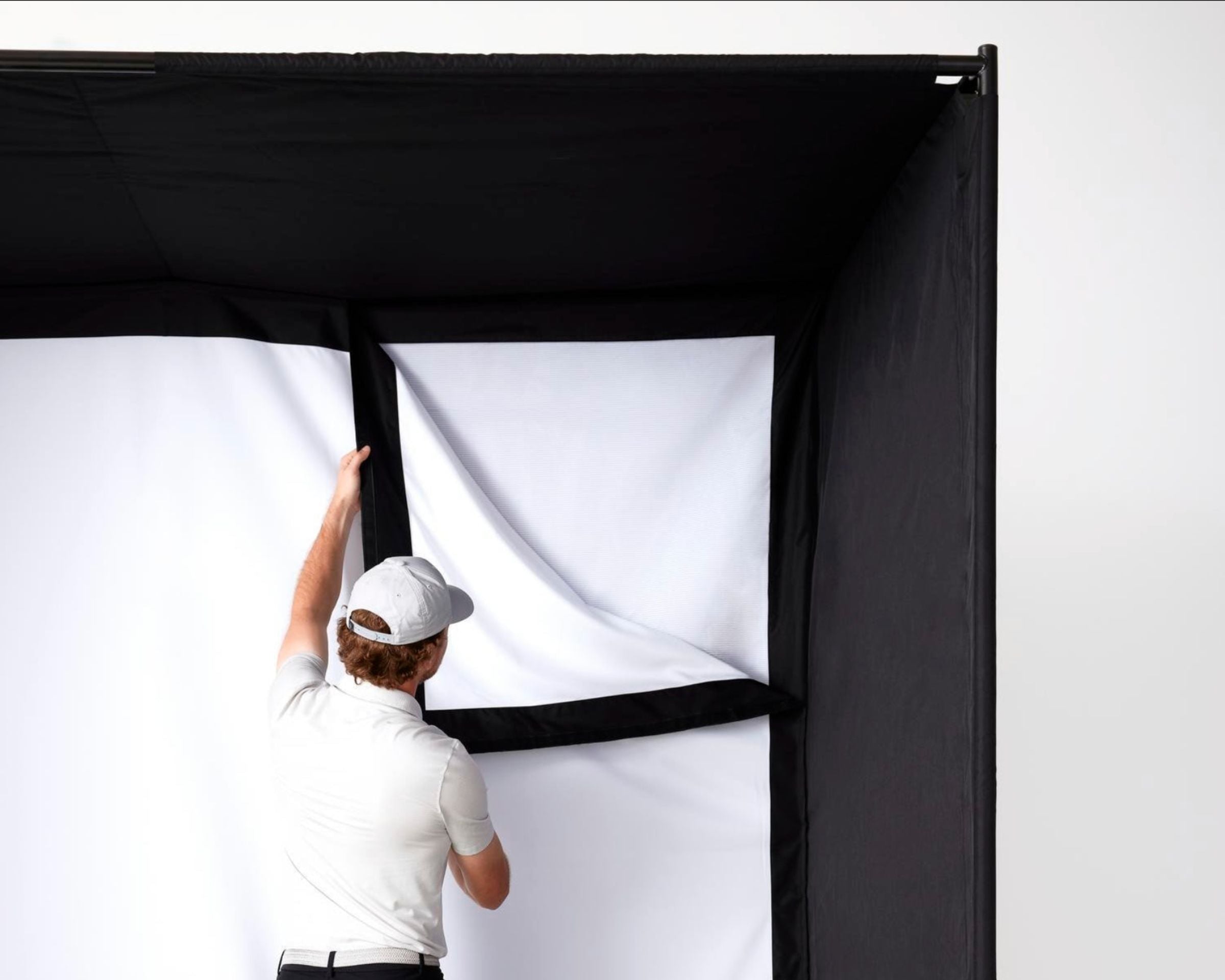 Installing SKYTRAK golf sim studio single layer impact screen 