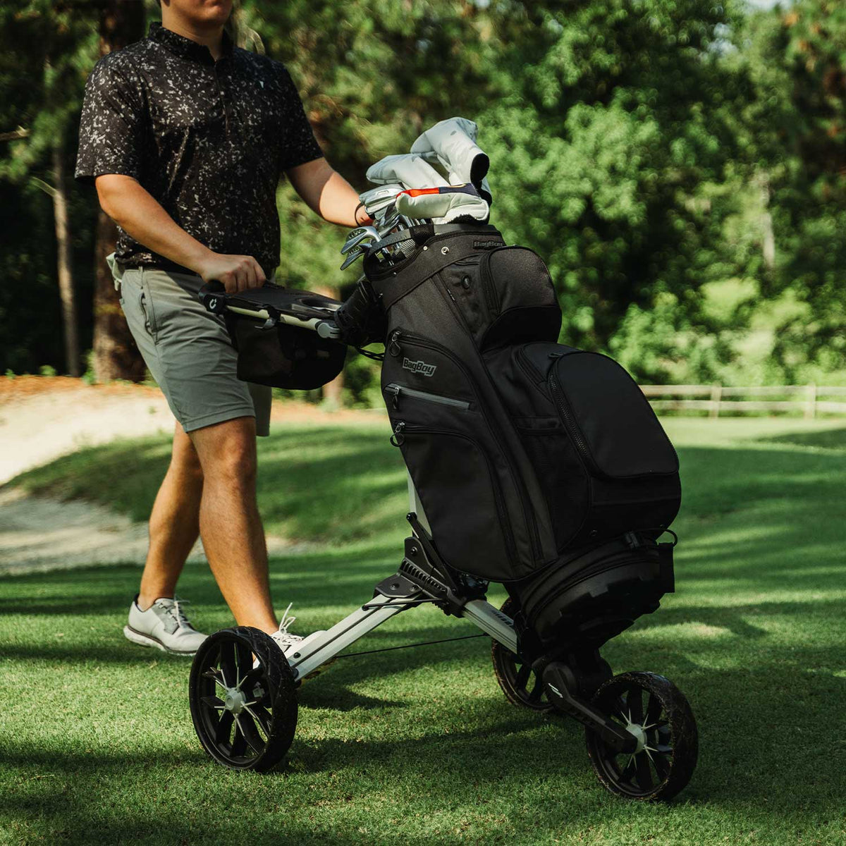 Bag Boy Nitron golf cart, sand and black, lifestyle photo