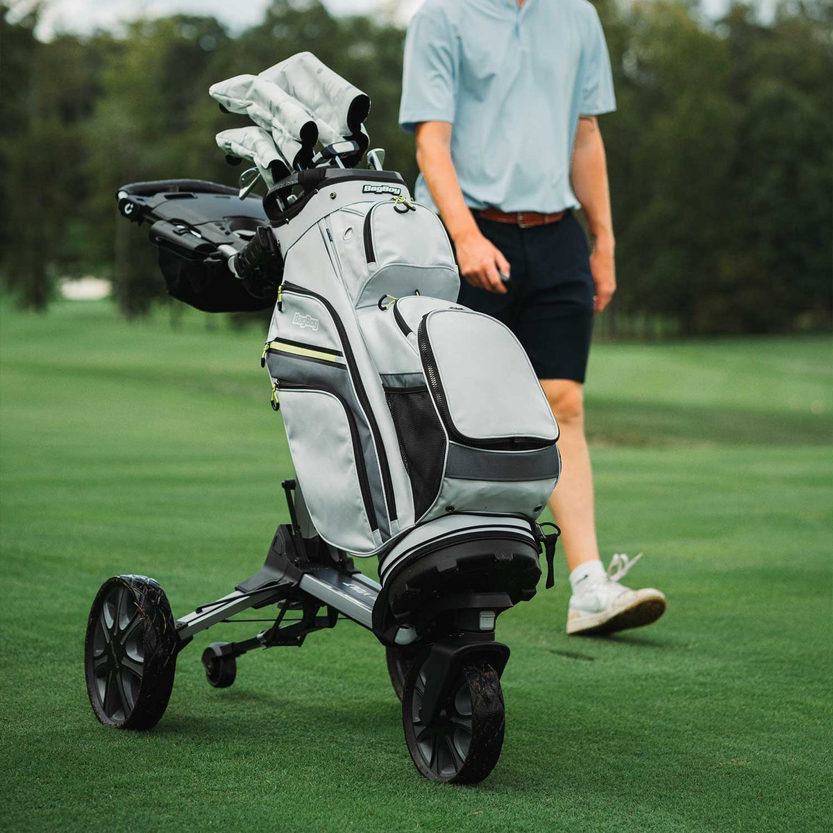 Bag Boy Volt golf cart, silver and black, with gray and citrus Chiller cooler bag accessory