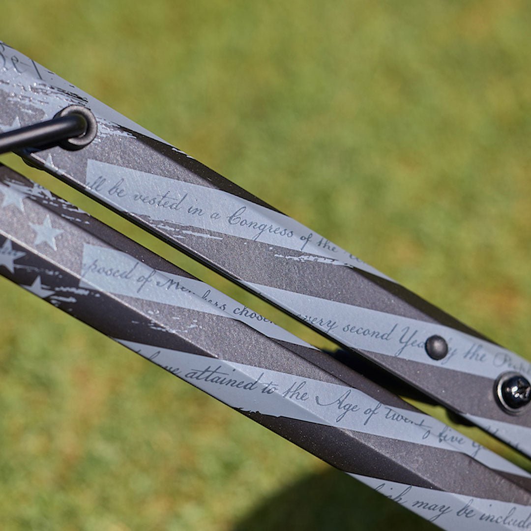 Close-up of the Motocaddy Nitron LTD USA Edition frame, showcasing the intricate laser-engraved patriotic text and signature design details that define this limited edition golf cart.