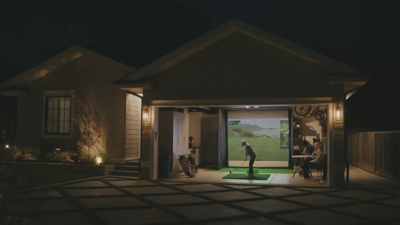 Experience the ultimate evening practice session with this home golf simulator setup in a garage, showcasing immersive gameplay and family-friendly entertainment that turns any space into a professional training ground.