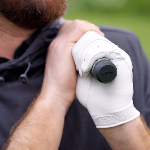 SKYTRAK compatible smart grip sensor attached to a golf club grip cap, capturing real-time swing mechanics and club data integration.